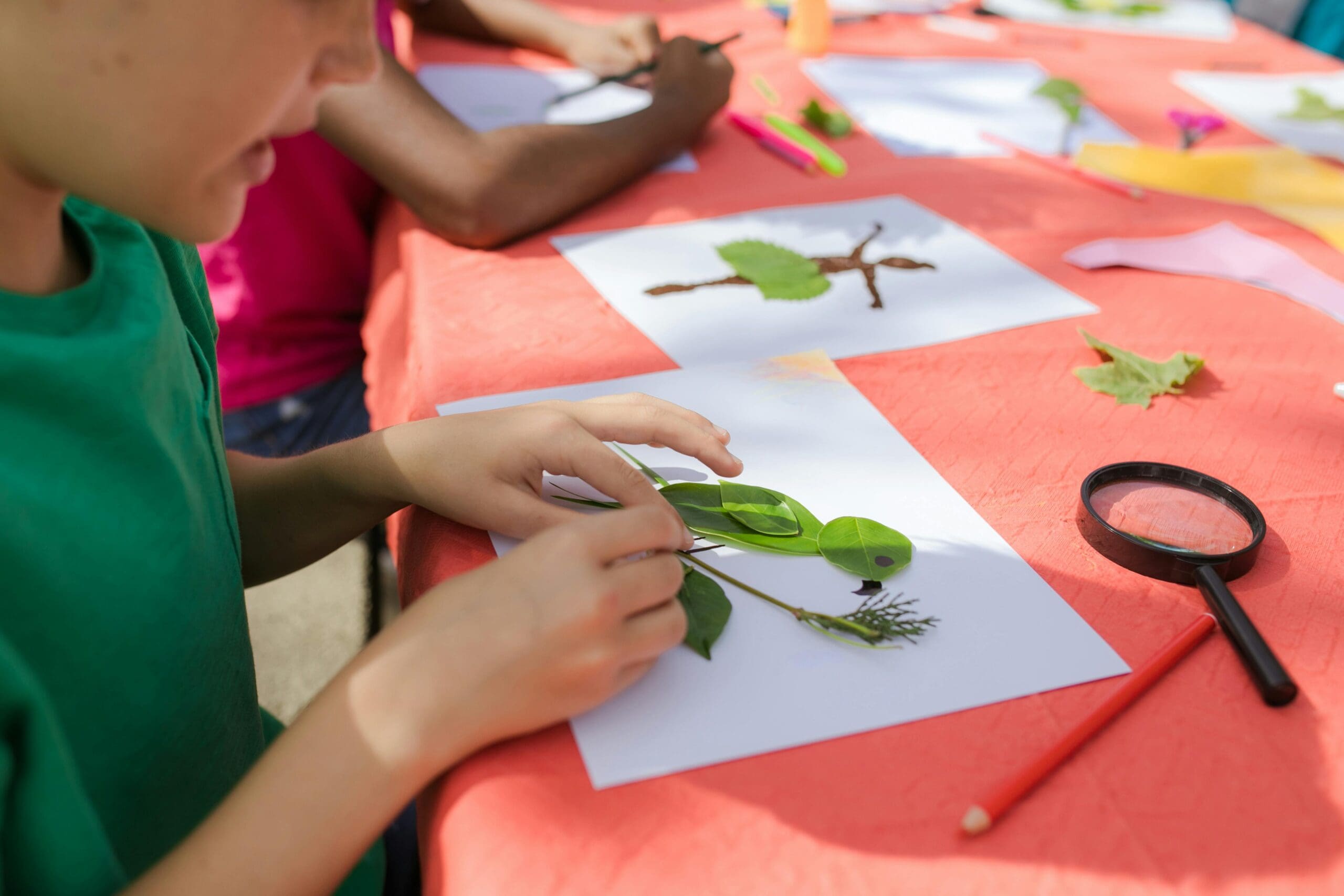 kids doing nature art as part of their summer plans
