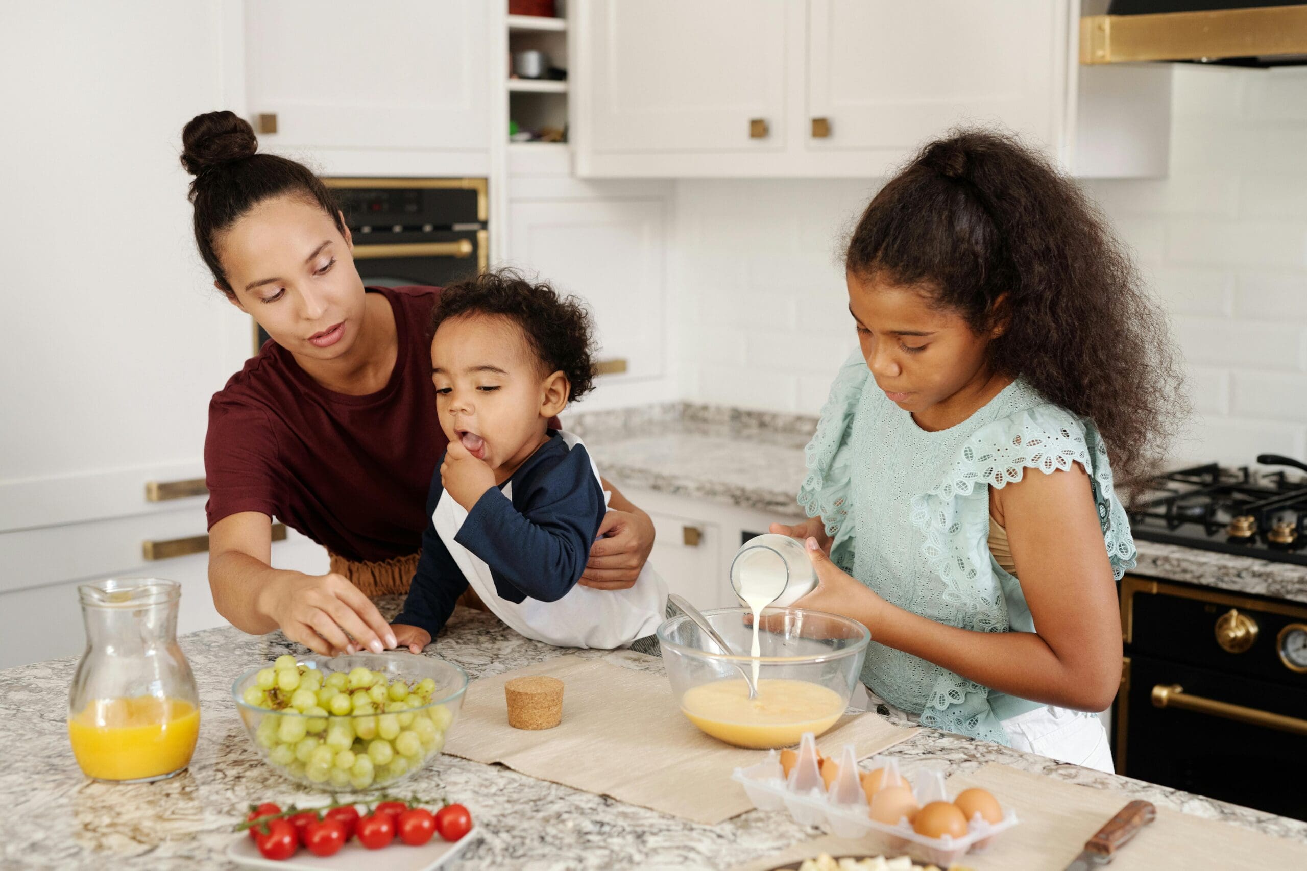 A mom making dinner with her kids